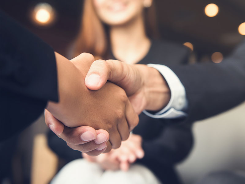 Brisbane outsourced professionals shaking hands